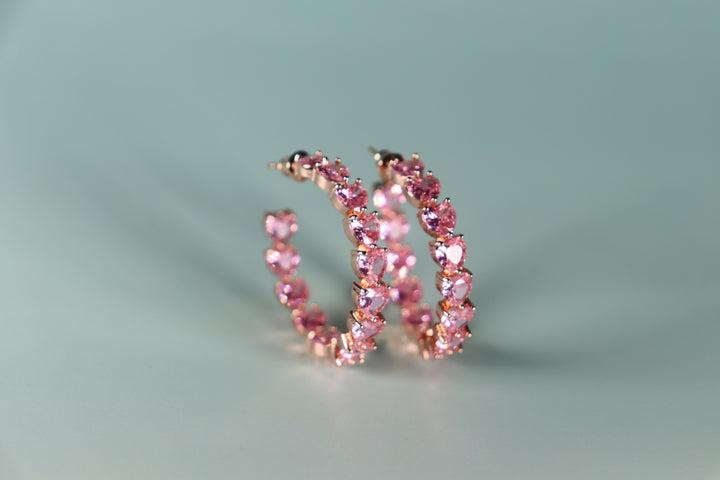 Gold plated heart hoop earrings with CZ stones, sparkling and lightweight fashion jewelry for women, perfect for adding a flirty touch to everyday or night-out looks.