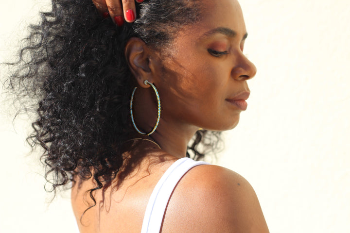 Gold plated hoop earrings with CZ stones, sparkling and lightweight fashion jewelry for women, perfect for adding a flirty touch to everyday or night-out looks.