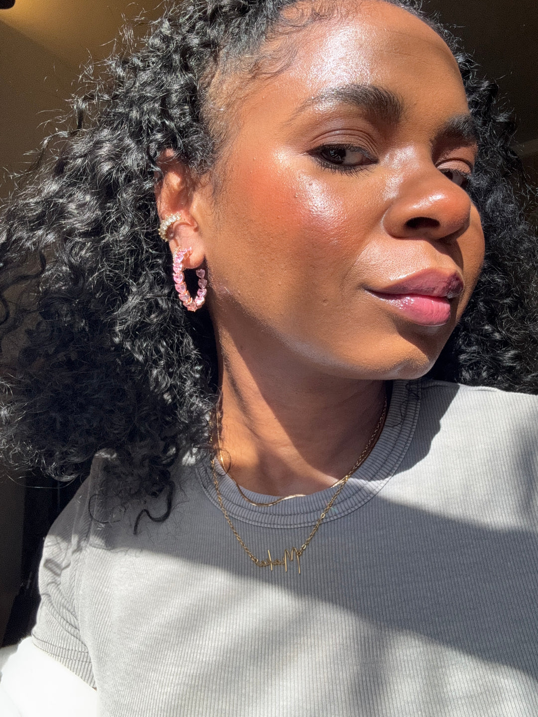 Gold plated heart hoop earrings with CZ stones, sparkling and lightweight fashion jewelry for women, perfect for adding a flirty touch to everyday or night-out looks.