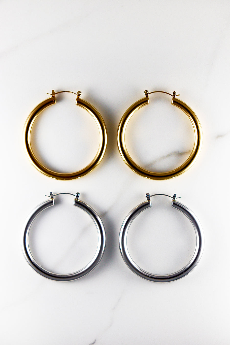Affordable gold plated hoop earrings for women, lightweight and tarnish resistant costume jewelry, perfect for everyday wear or stacking with trendy gold accessories.