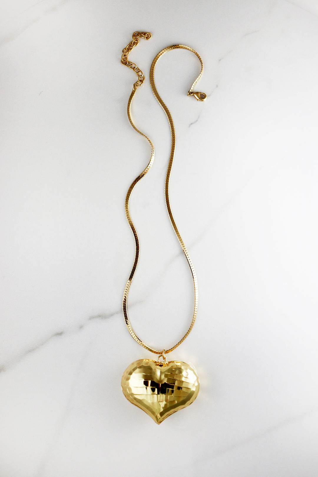 Chunky gold chain necklace made from durable costume jewelry materials, trendy and affordable with a polished finish, great for layering or statement wear.