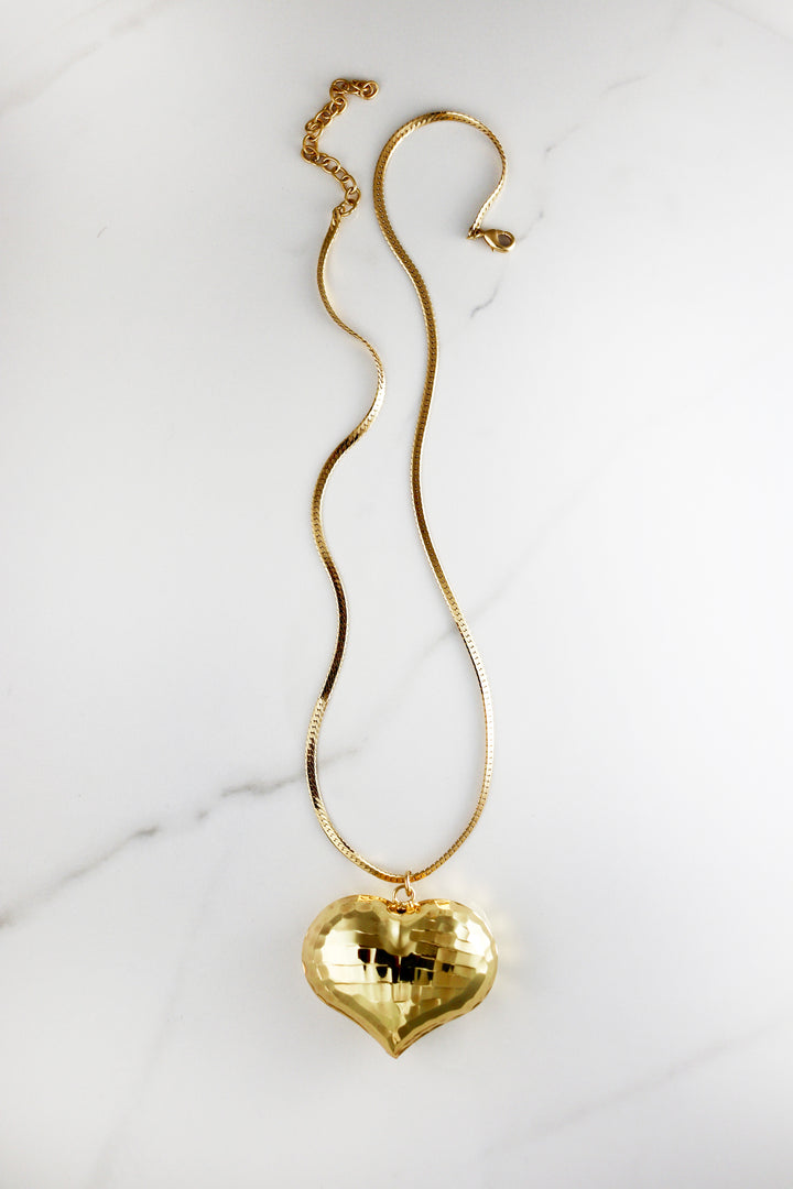 Chunky gold chain necklace made from durable costume jewelry materials, trendy and affordable with a polished finish, great for layering or statement wear.