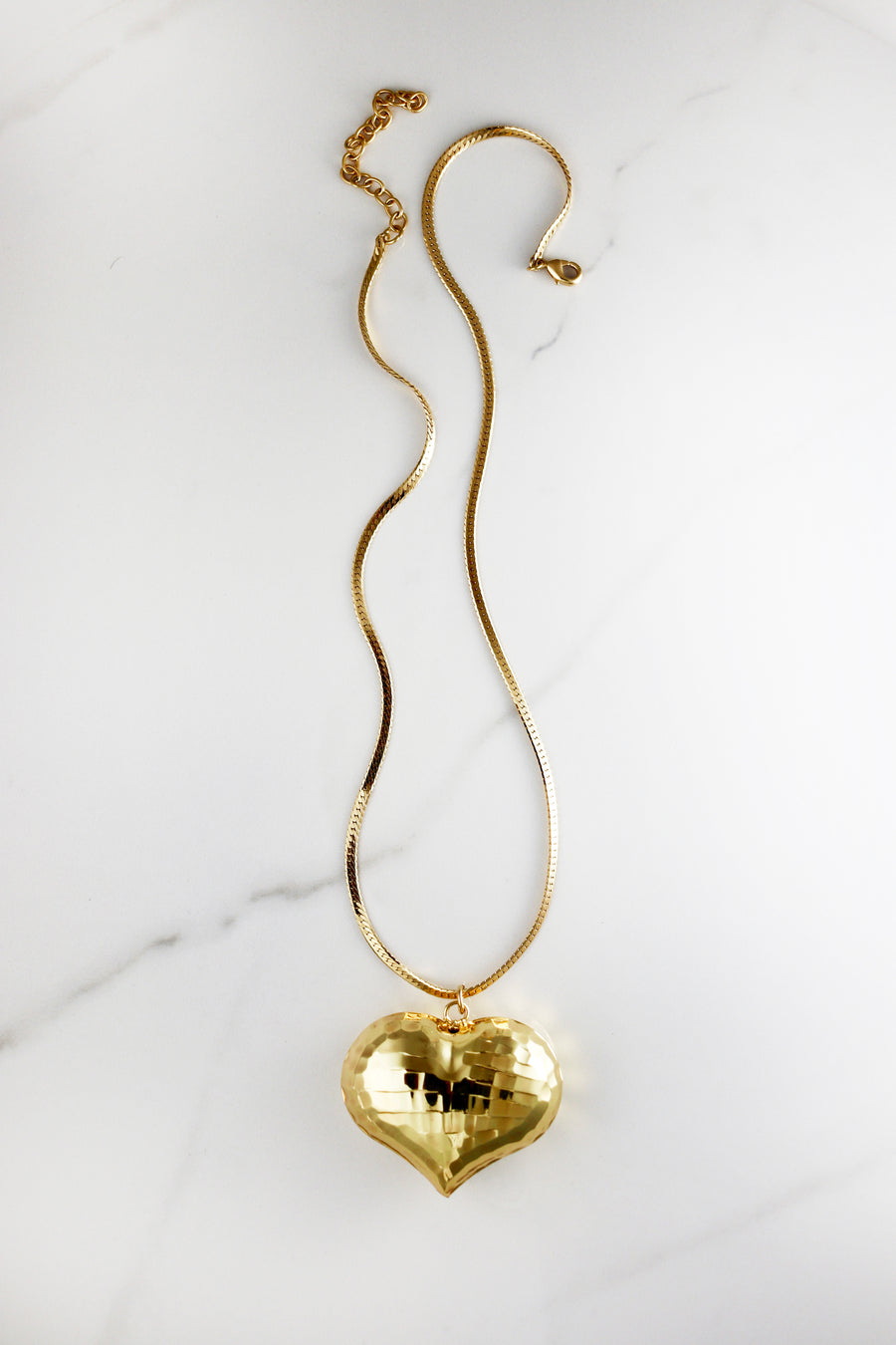 Chunky gold chain necklace made from durable costume jewelry materials, trendy and affordable with a polished finish, great for layering or statement wear.
