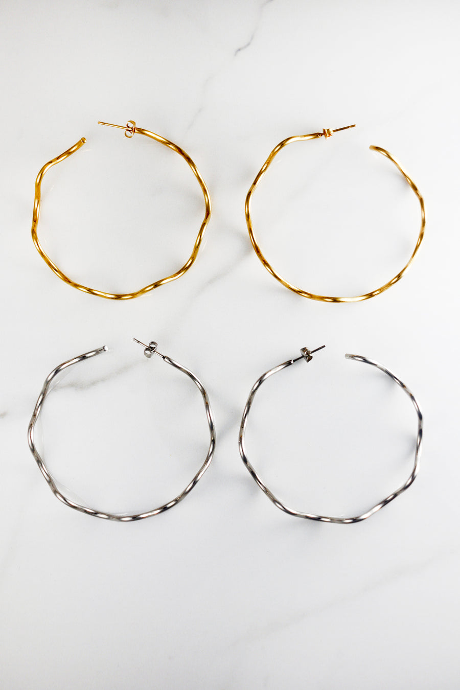 Affordable gold plated hoop earrings for women, lightweight and tarnish resistant costume jewelry, perfect for everyday wear or stacking with trendy gold accessories.