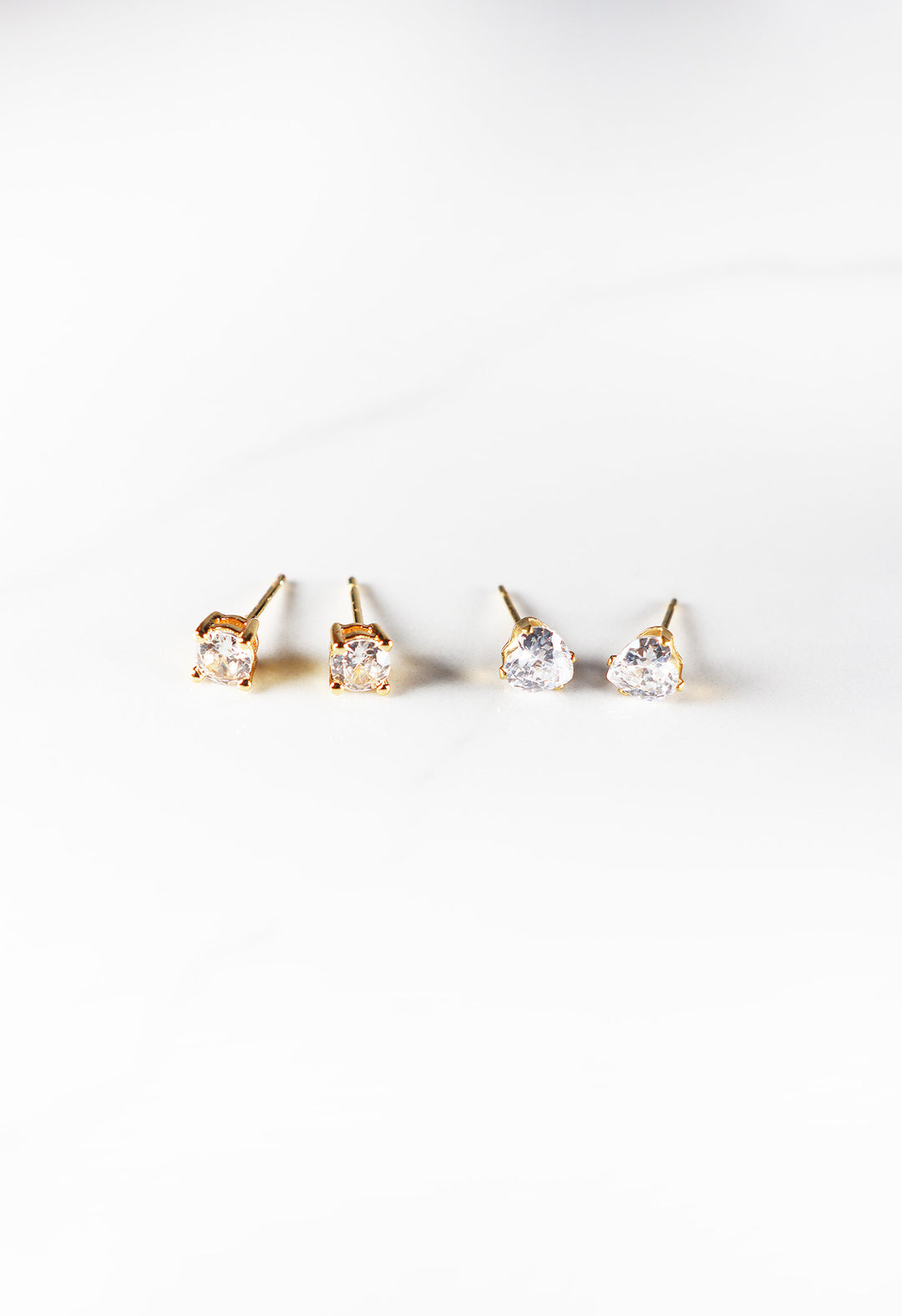 Cubic zirconia stud earrings for women, classic and affordable gold plated fashion jewelry with a diamond-like sparkle, perfect for everyday wear or special occasions.