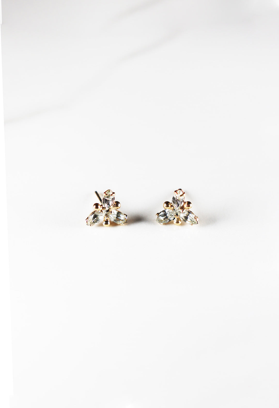 Cubic zirconia stud earrings for women, classic and affordable gold plated fashion jewelry with a diamond-like sparkle, perfect for everyday wear or special occasions.