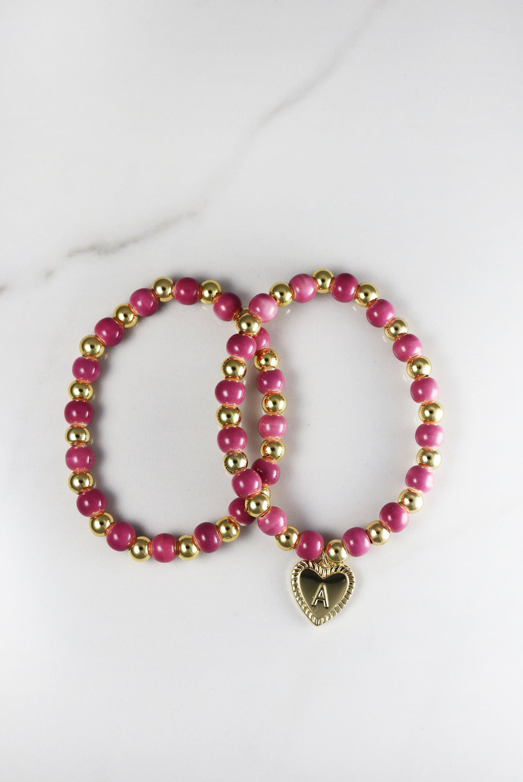 Beaded initial bracelet for women, customizable and affordable fashion jewelry featuring gold accents and letter beads, perfect for stacking or gifting.