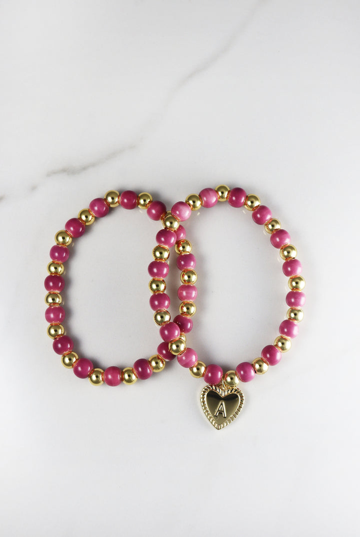 Beaded initial bracelet for women, customizable and affordable fashion jewelry featuring gold accents and letter beads, perfect for stacking or gifting.