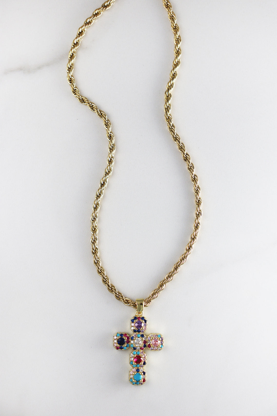 Gold plated cross necklace with CZ stones, available in two options—colorful cubic zirconia or classic diamond-like stones, stylish and affordable costume jewelry for women.