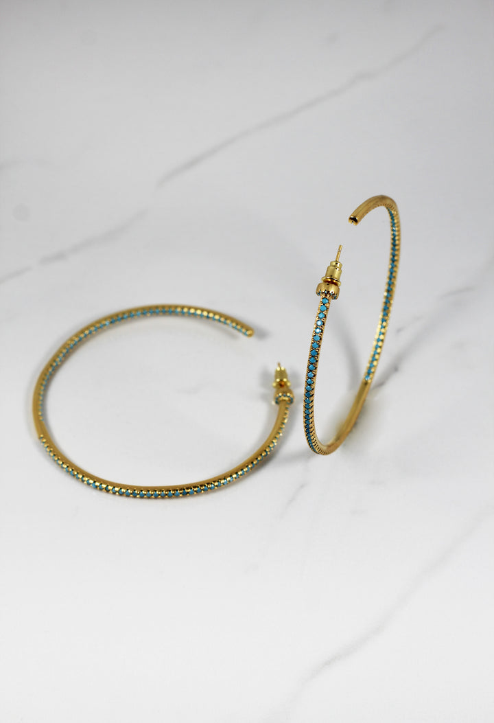 Gold plated hoop earrings with CZ stones, sparkling and lightweight fashion jewelry for women, perfect for adding a flirty touch to everyday or night-out looks.