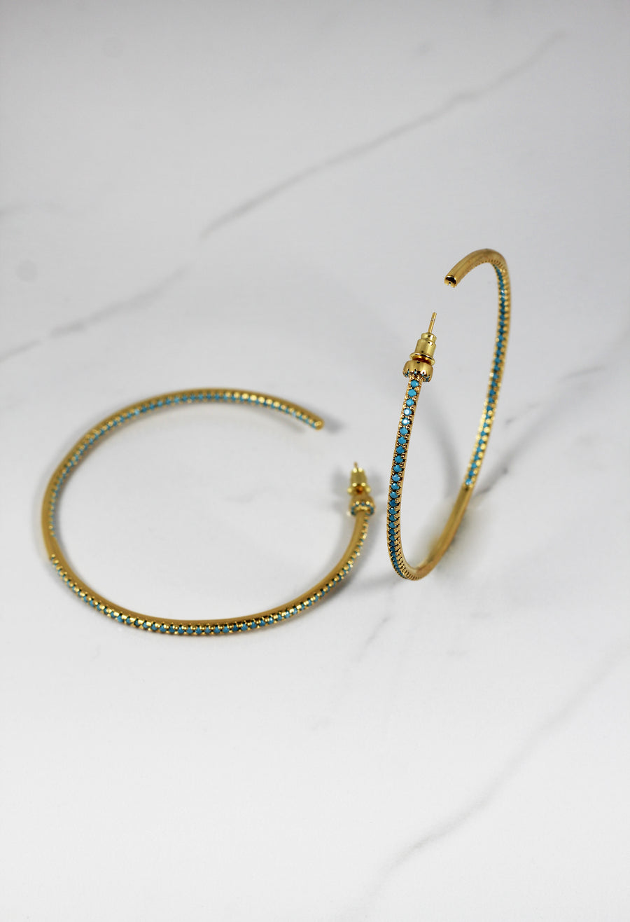 Gold plated hoop earrings with CZ stones, sparkling and lightweight fashion jewelry for women, perfect for adding a flirty touch to everyday or night-out looks.