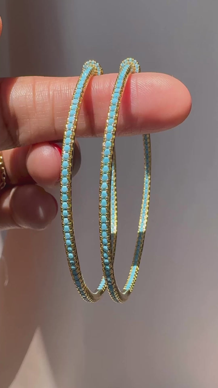 Gold plated hoop earrings with CZ stones, sparkling and lightweight fashion jewelry for women, perfect for adding a flirty touch to everyday or night-out looks.