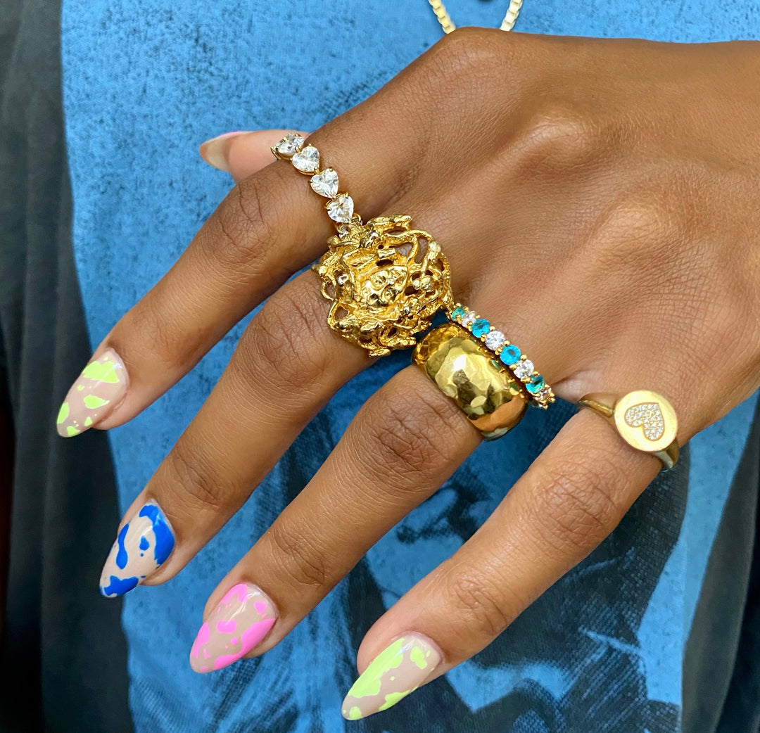 How to Style a Statement Cocktail Ring with Stacked Gold Rings