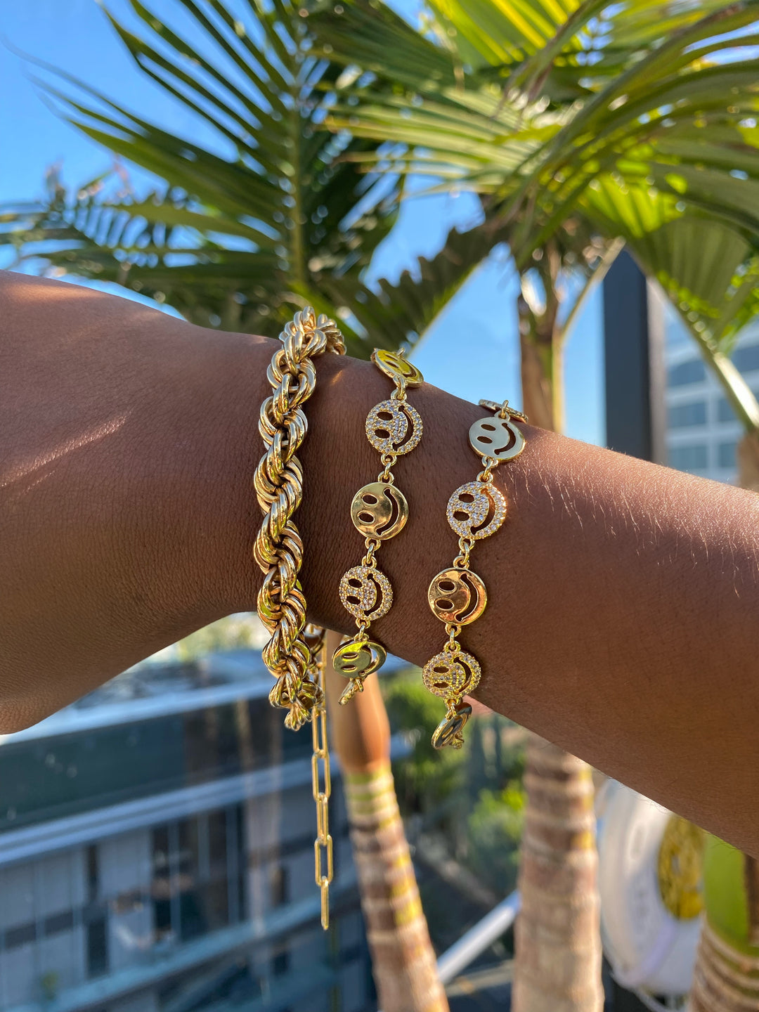 Layering Gold Bracelets: Style Tips for Smiley Face and Classic Designs