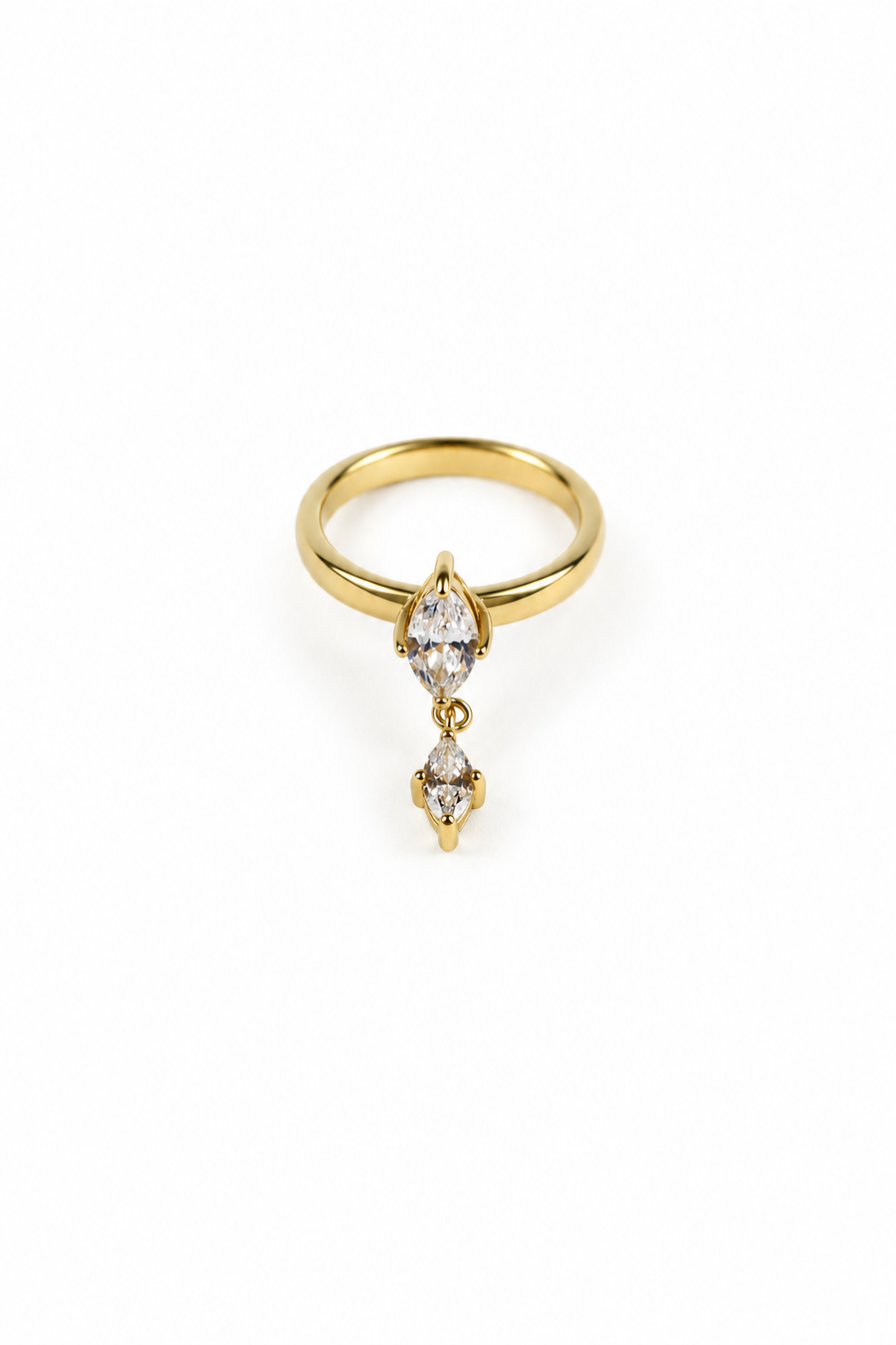 A gold ring featuring three marquise-cut clear gemstones arranged vertically, set on a plain white background.