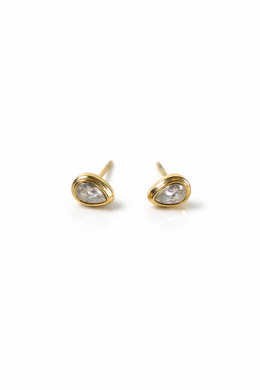 Gold stud earrings with clear gemstones on a white background