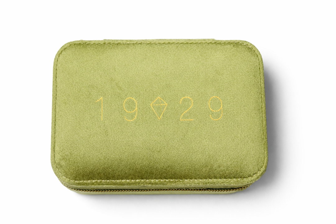 Green case with '1929' embossed on a white background
