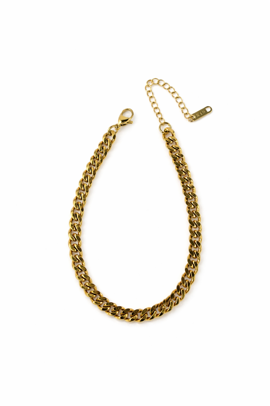 Gold cuban link anklet on a white background