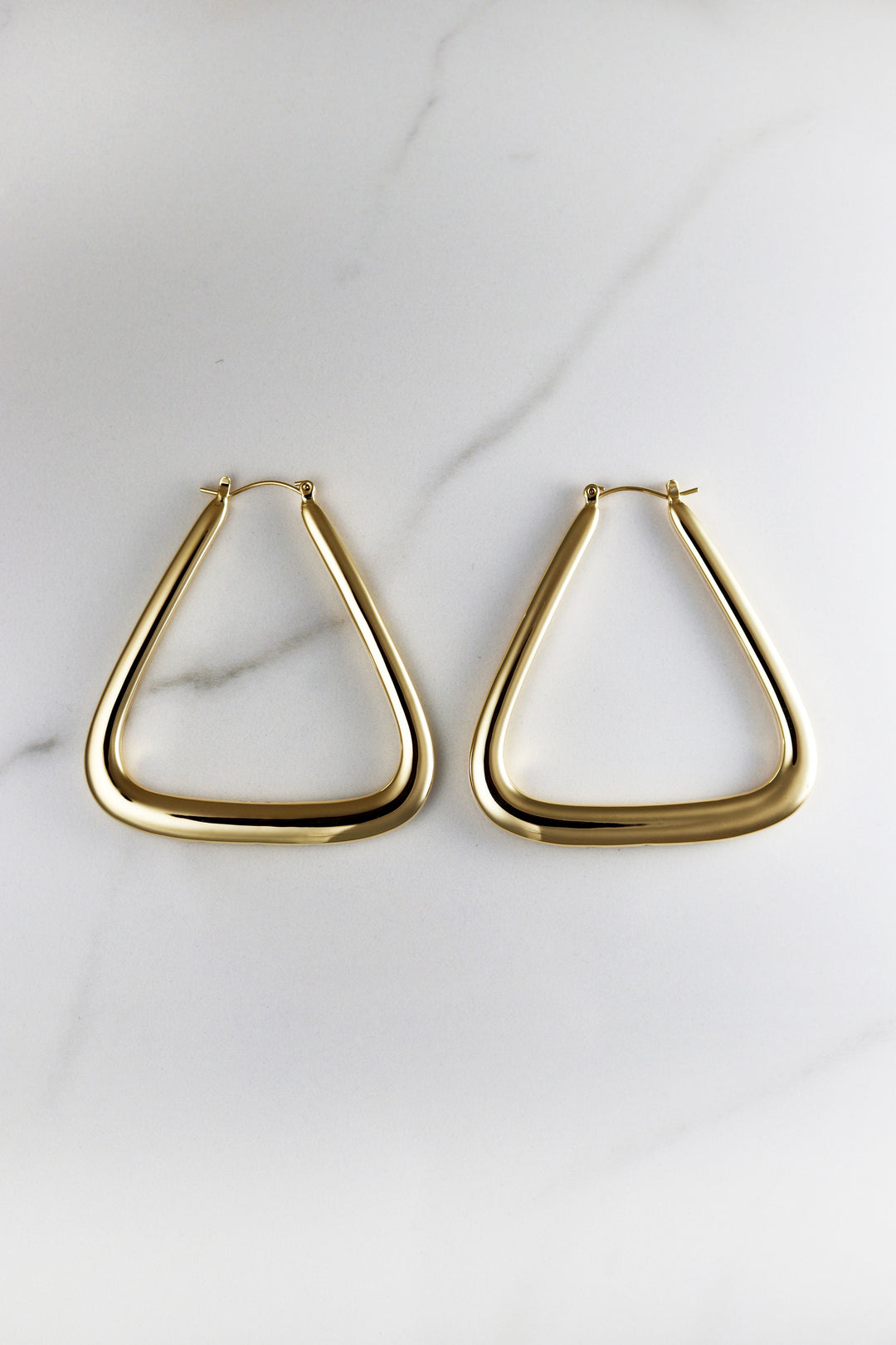 Affordable gold plated hoop earrings for women, lightweight and tarnish resistant costume jewelry, perfect for everyday wear or stacking with trendy gold accessories.

