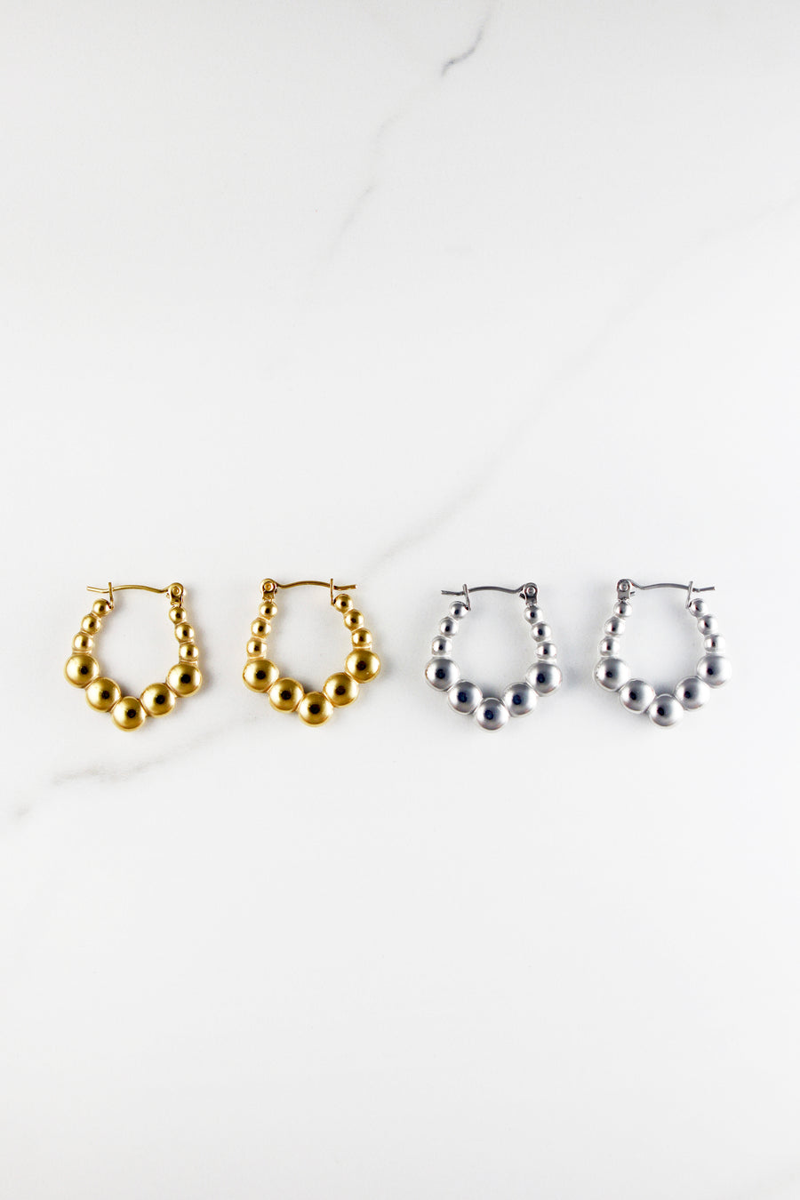 Affordable gold plated hoop earrings for women, lightweight and tarnish resistant costume jewelry, perfect for everyday wear or stacking with trendy gold accessories.


